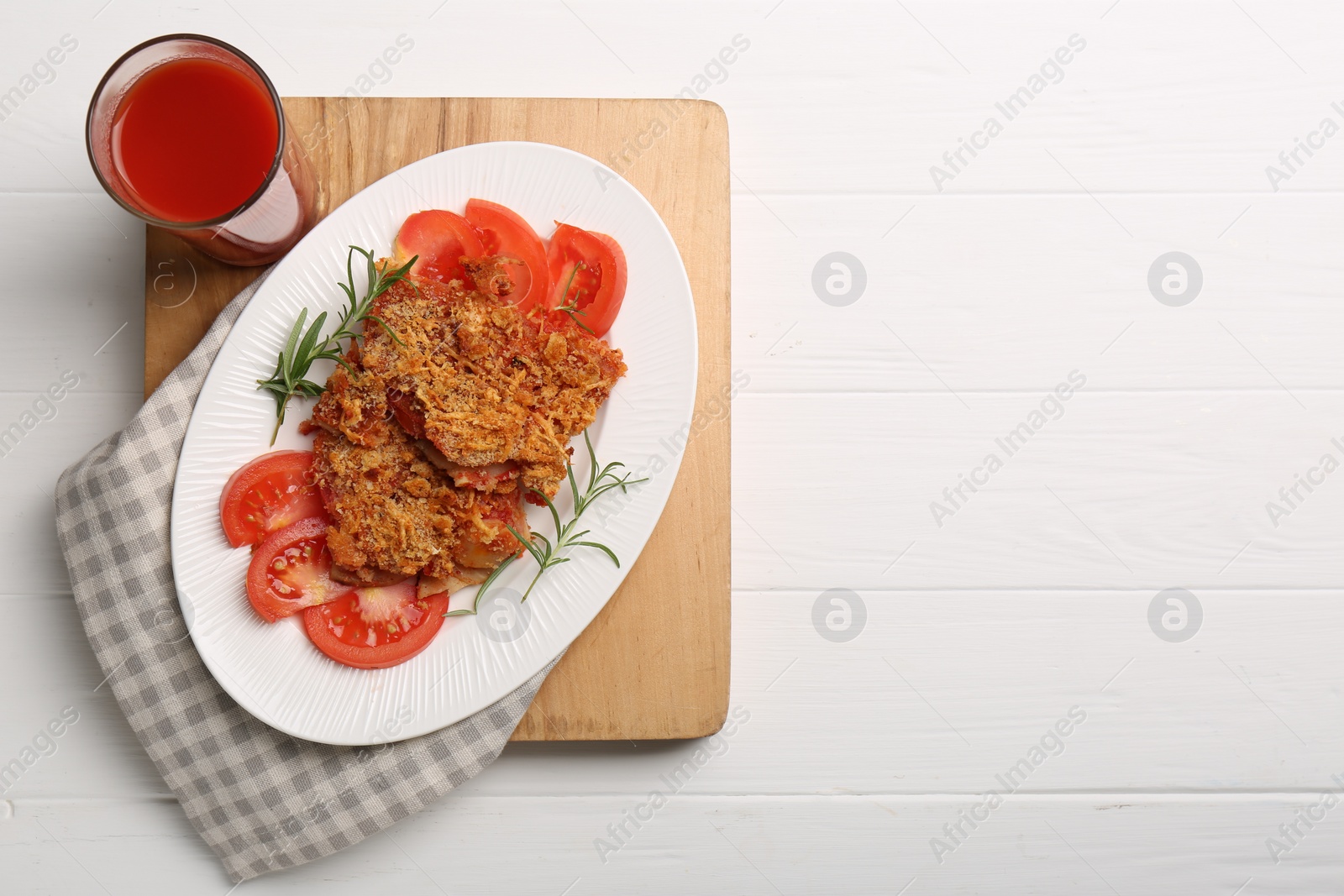 Photo of Tasty fried parsnips with fresh tomatoes and rosemary on white wooden table, top view. Space for text