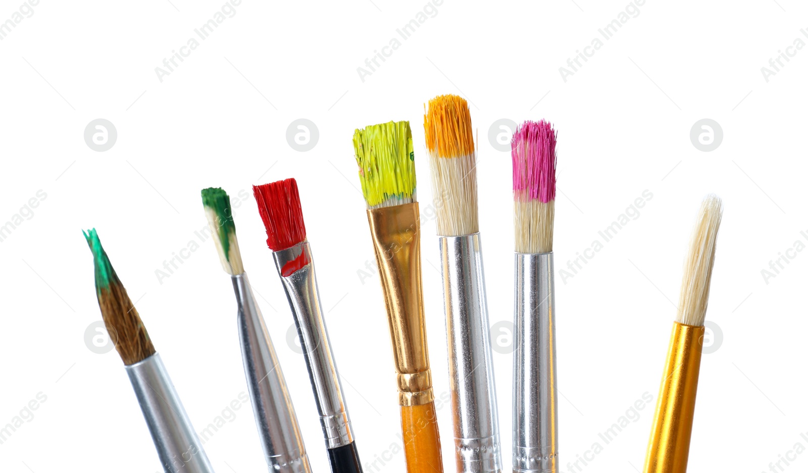 Photo of Different brushes with paints on white background