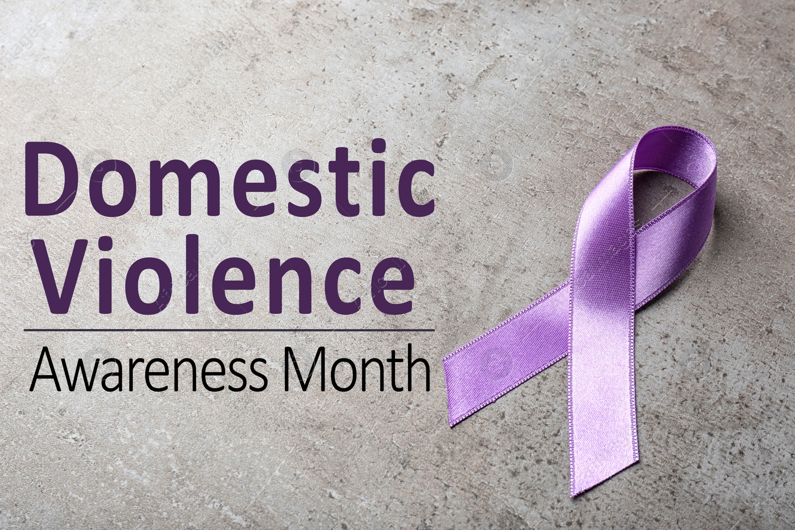 Image of Purple ribbon on grey background. Symbol of Domestic Violence Awareness