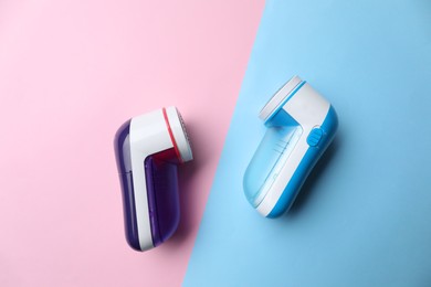 Modern fabric shavers on color background, flat lay