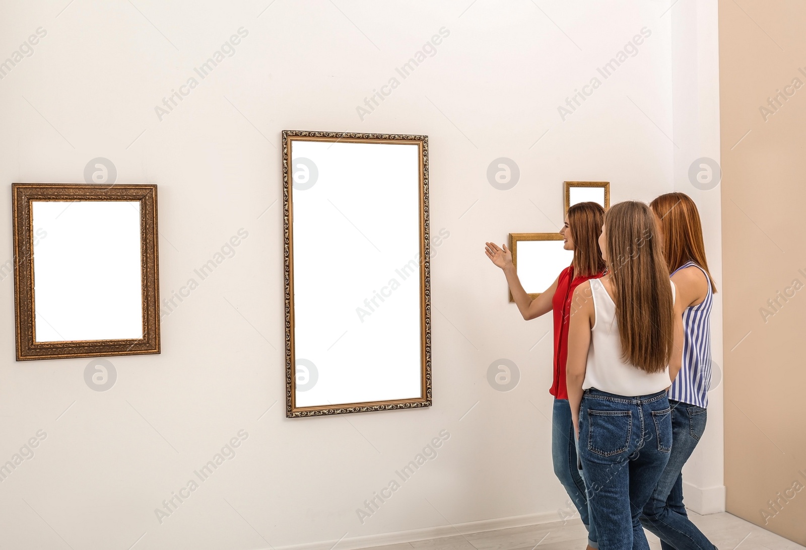 Photo of People viewing exposition in modern art gallery