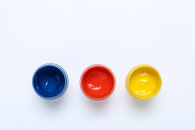 Photo of Composition with paints on white background, top view