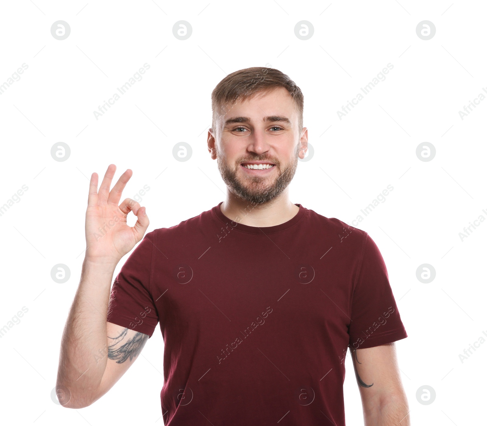 Photo of Man showing OK gesture in sign language on white background