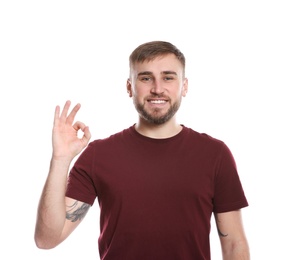 Photo of Man showing OK gesture in sign language on white background