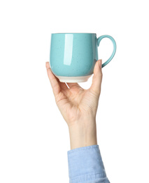 Photo of Woman holding light blue cup on white background, closeup