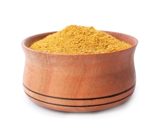 Photo of Wooden bowl with curry powder on white background. Different spices