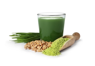 Photo of Glass of wheat grass juice, seeds, sprouts and scoop with powder on white background