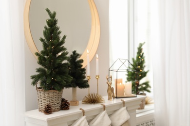 Photo of Different Christmas decorations in room. Interior design