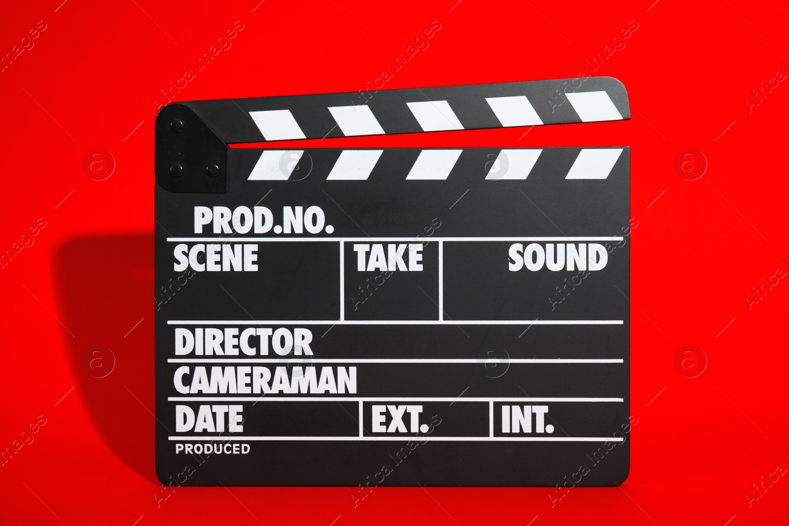 Photo of Clapperboard on color background. Modern cinema production