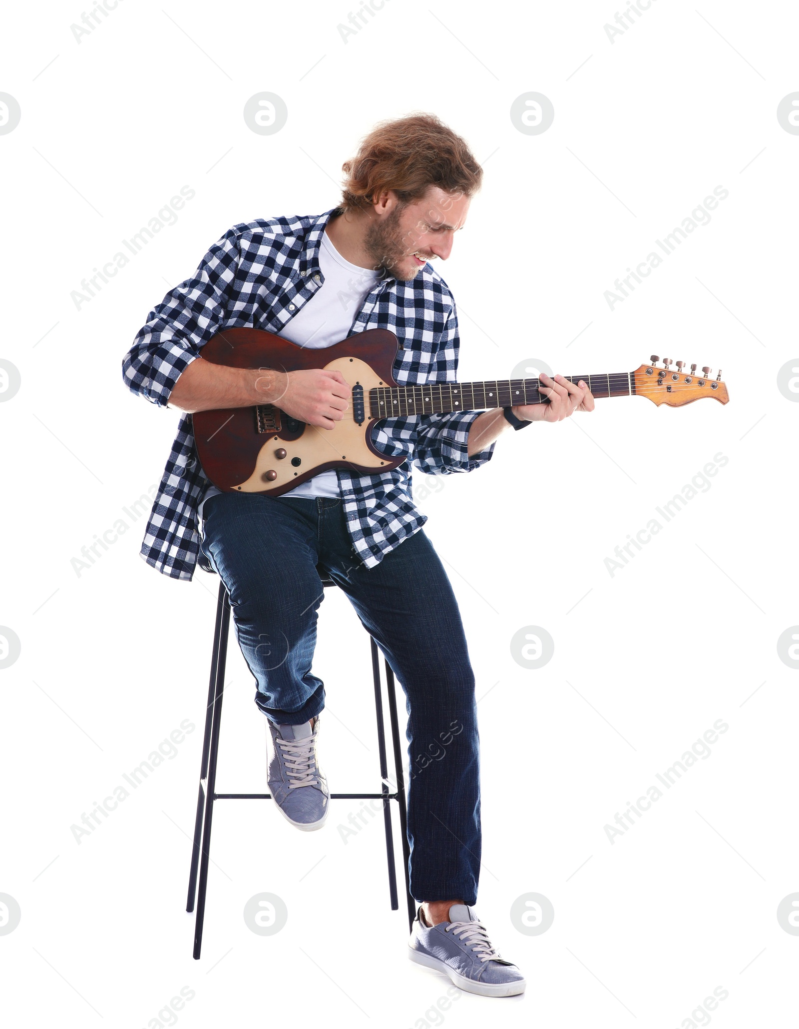 Photo of Young man playing electric guitar on white background
