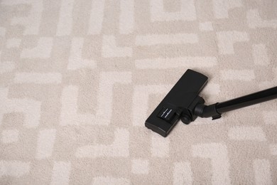 Photo of Hoovering floor with modern vacuum cleaner, above view. Space for text