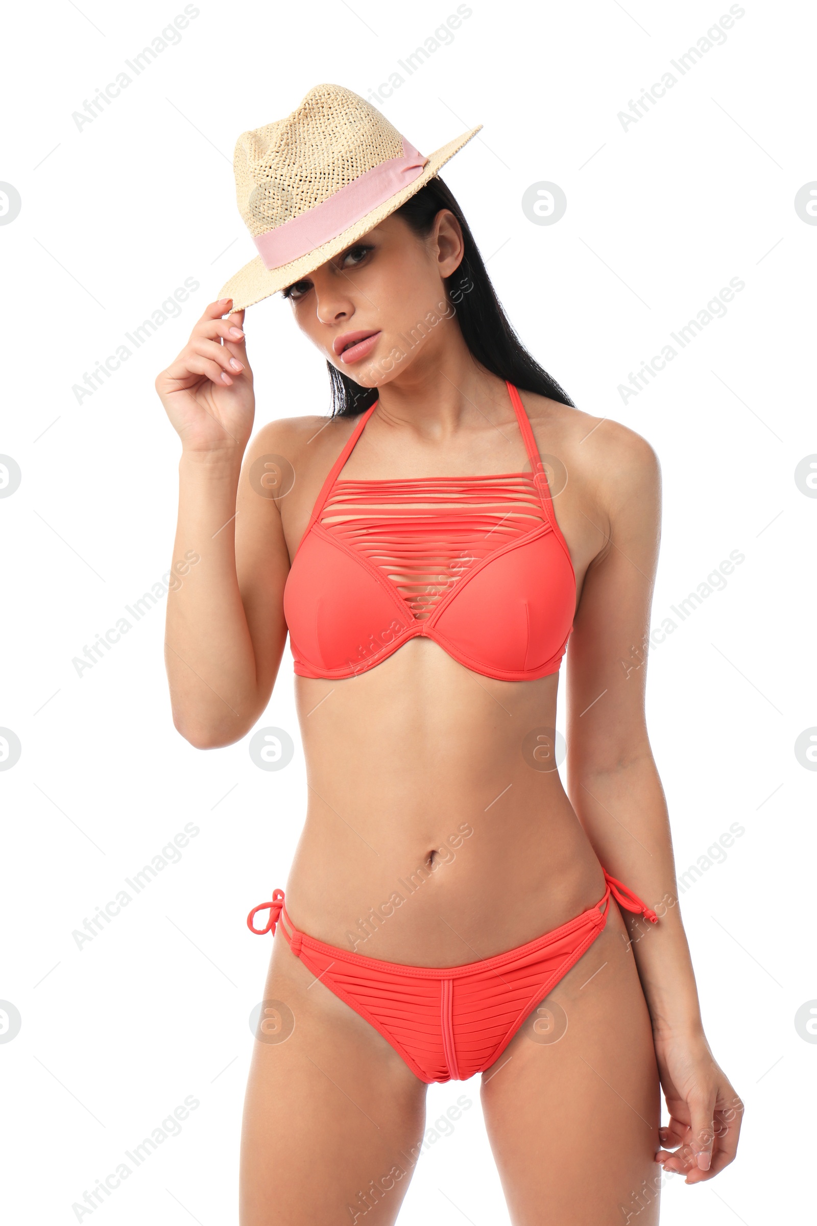 Photo of Beautiful young woman in stylish bikini with hat on white background