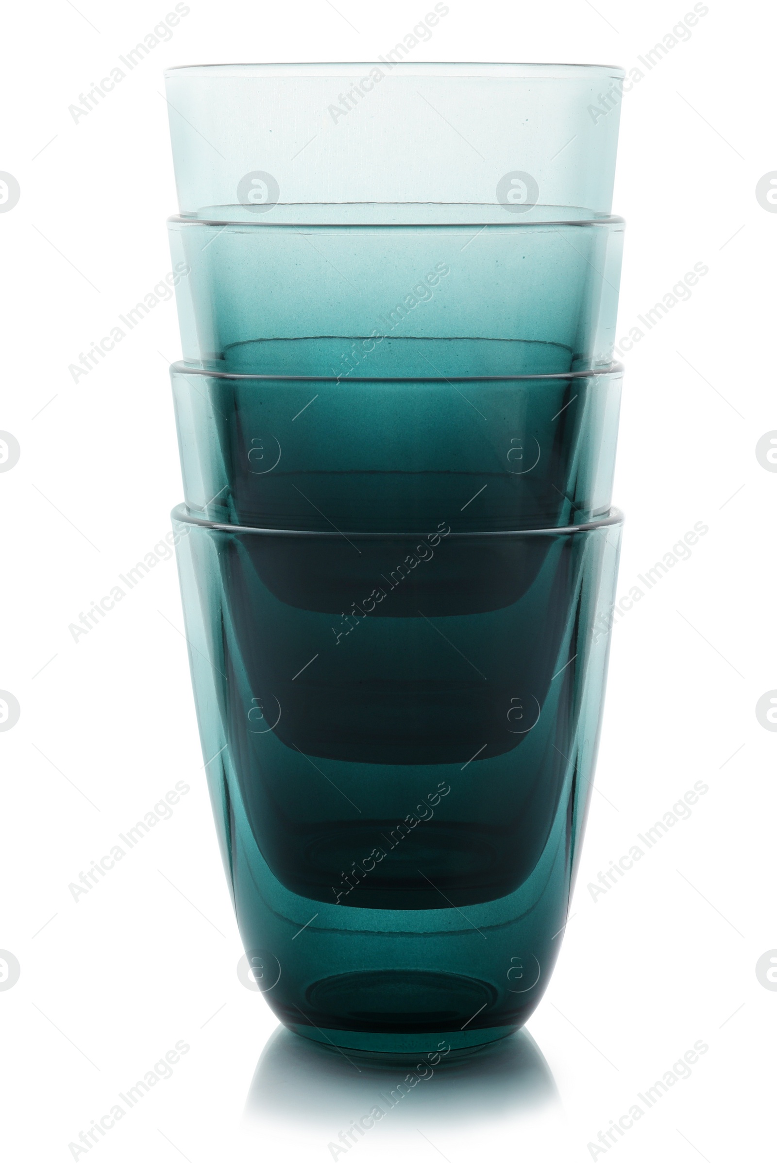 Photo of Stack of empty colorful glasses on white background