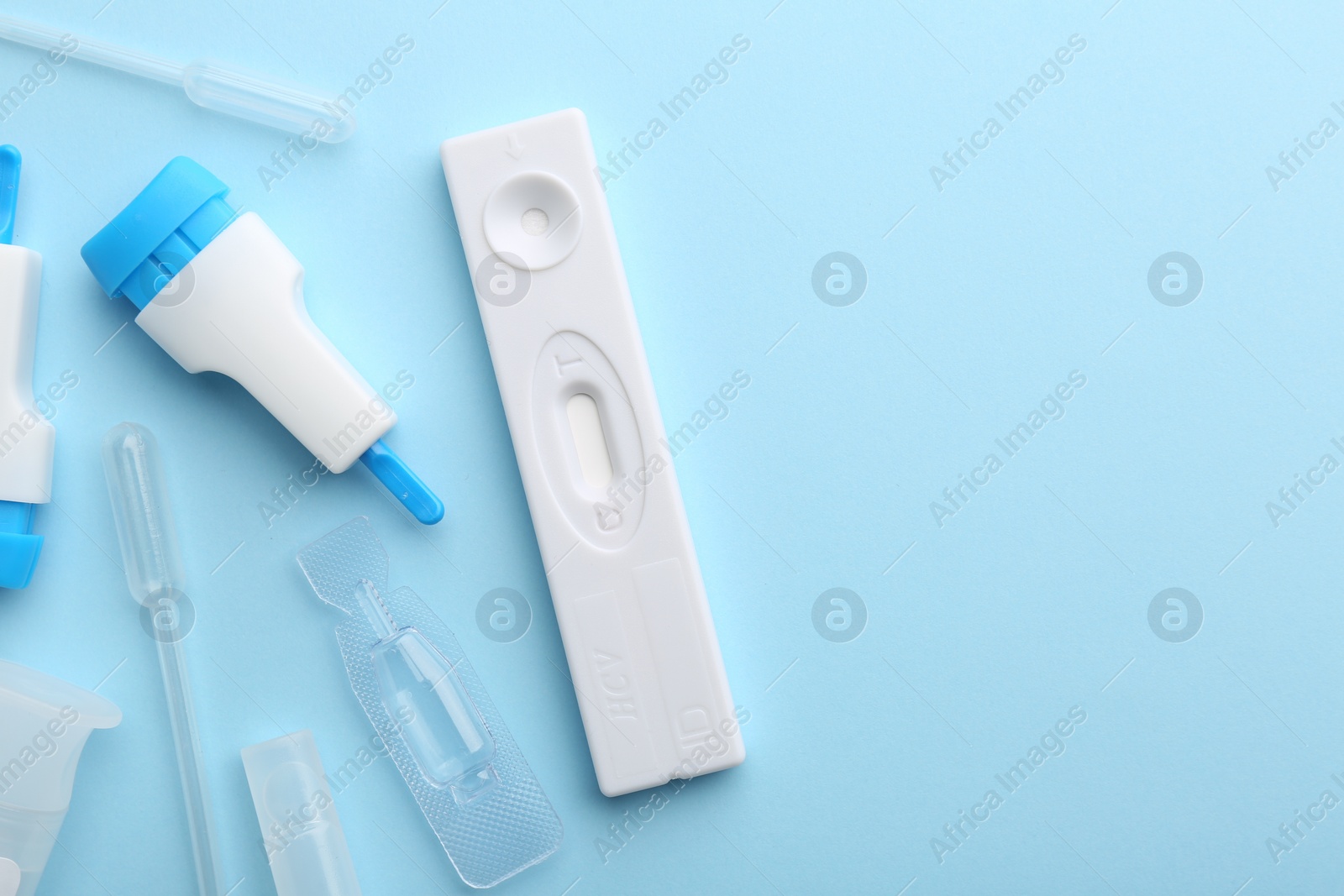 Photo of Disposable express test kit on light blue background, flat lay. Space for text