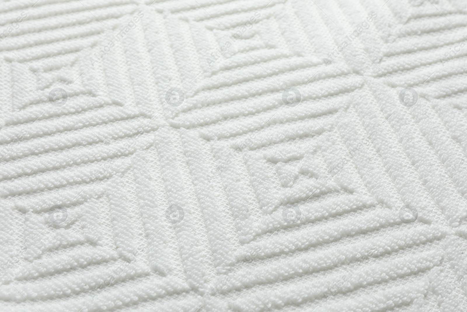 Photo of Texture of white fabric as background, closeup