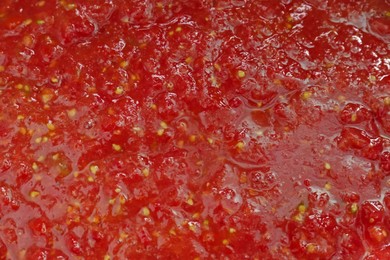 Photo of Red tomato juice as background, closeup view