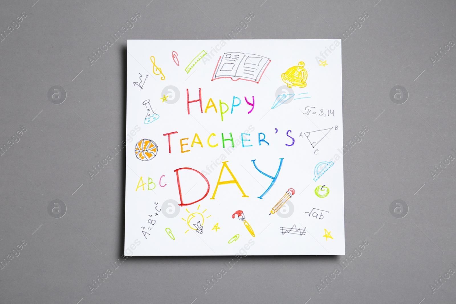 Photo of Paper with inscription HAPPY TEACHER'S DAY on grey background, top view