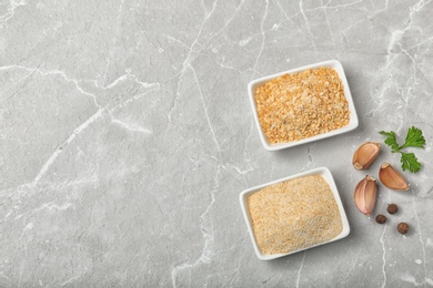 Flat lay composition with garlic products on grey background