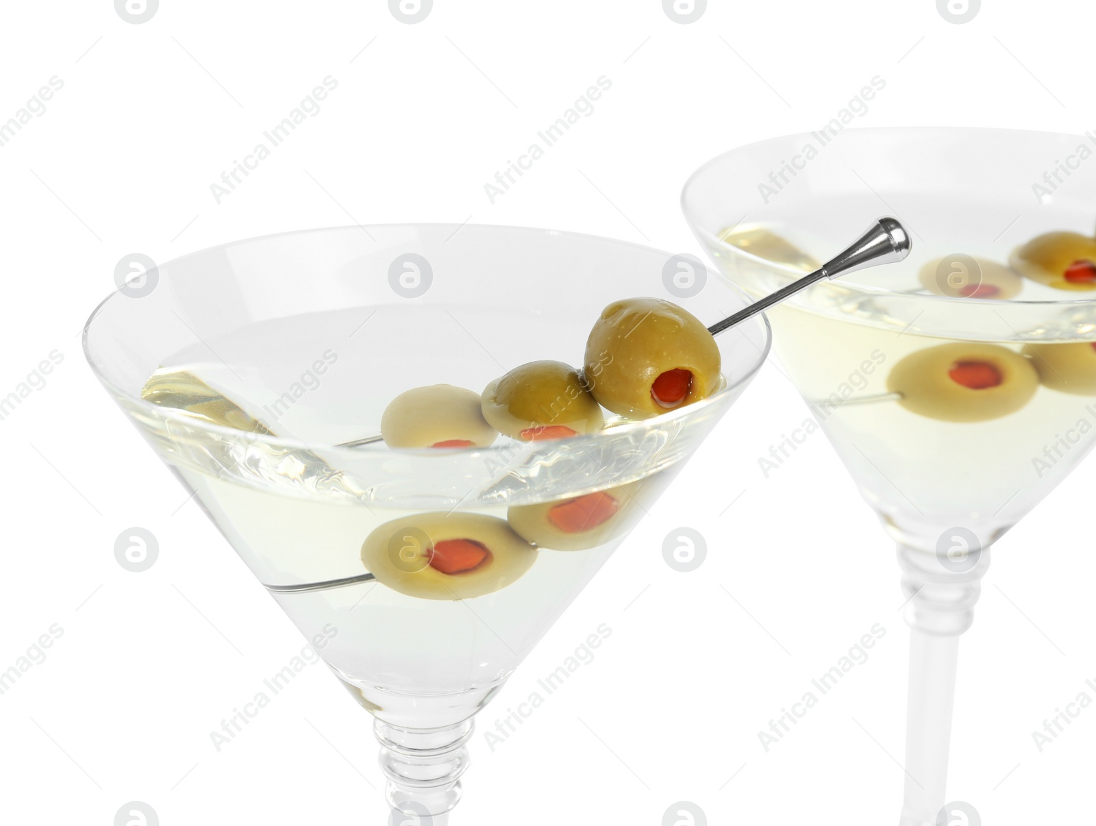 Photo of Martini cocktail with olives on white background