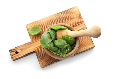 Photo of Mortar with fresh green basil leaves on white background, top view