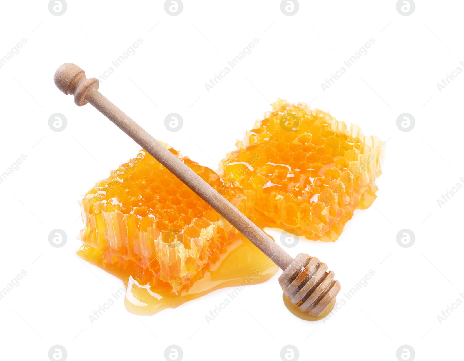 Photo of Natural honeycombs with honey and wooden dipper isolated on white