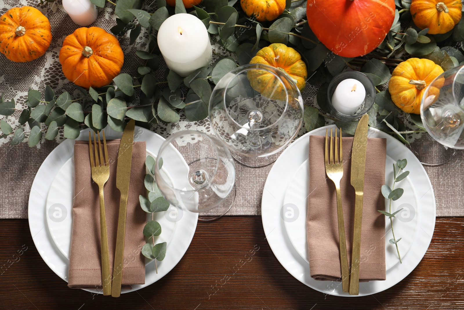 Photo of Beautiful autumn table setting. Plates, cutlery, glasses, pumpkins and floral decor, flat lay