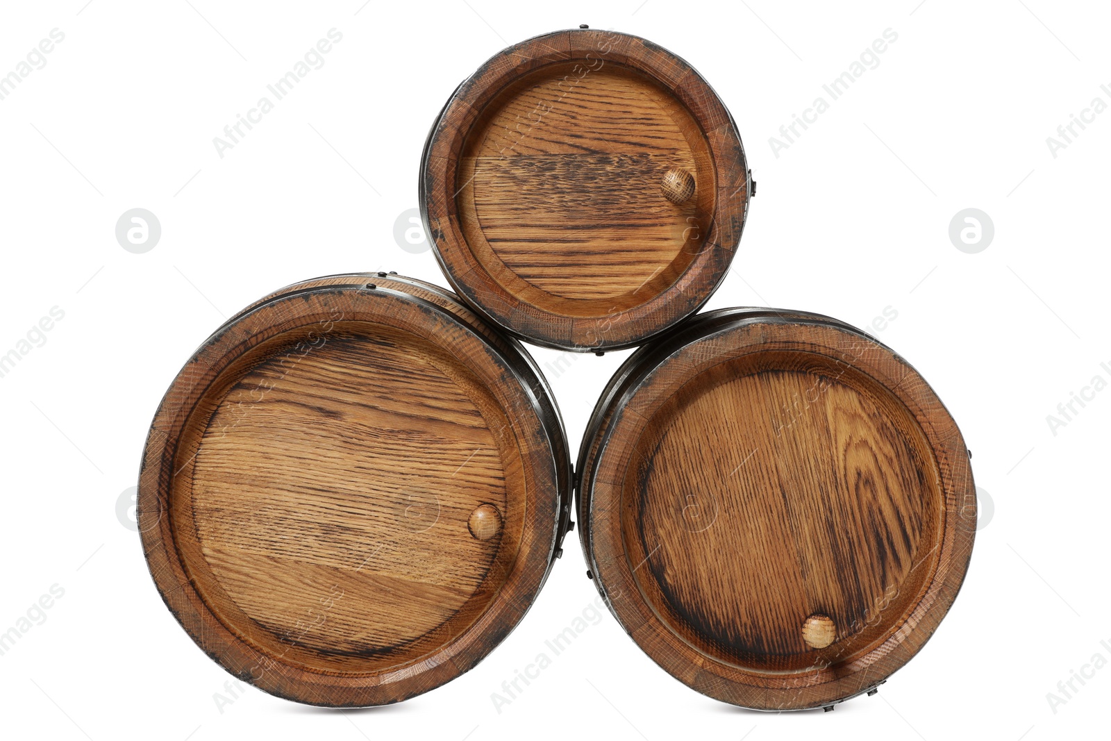 Photo of Three traditional wooden barrels on white background