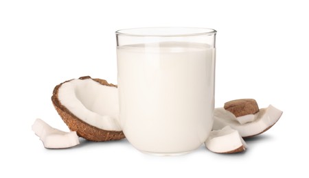 Photo of Glass of delicious vegan milk and coconut pieces on white background