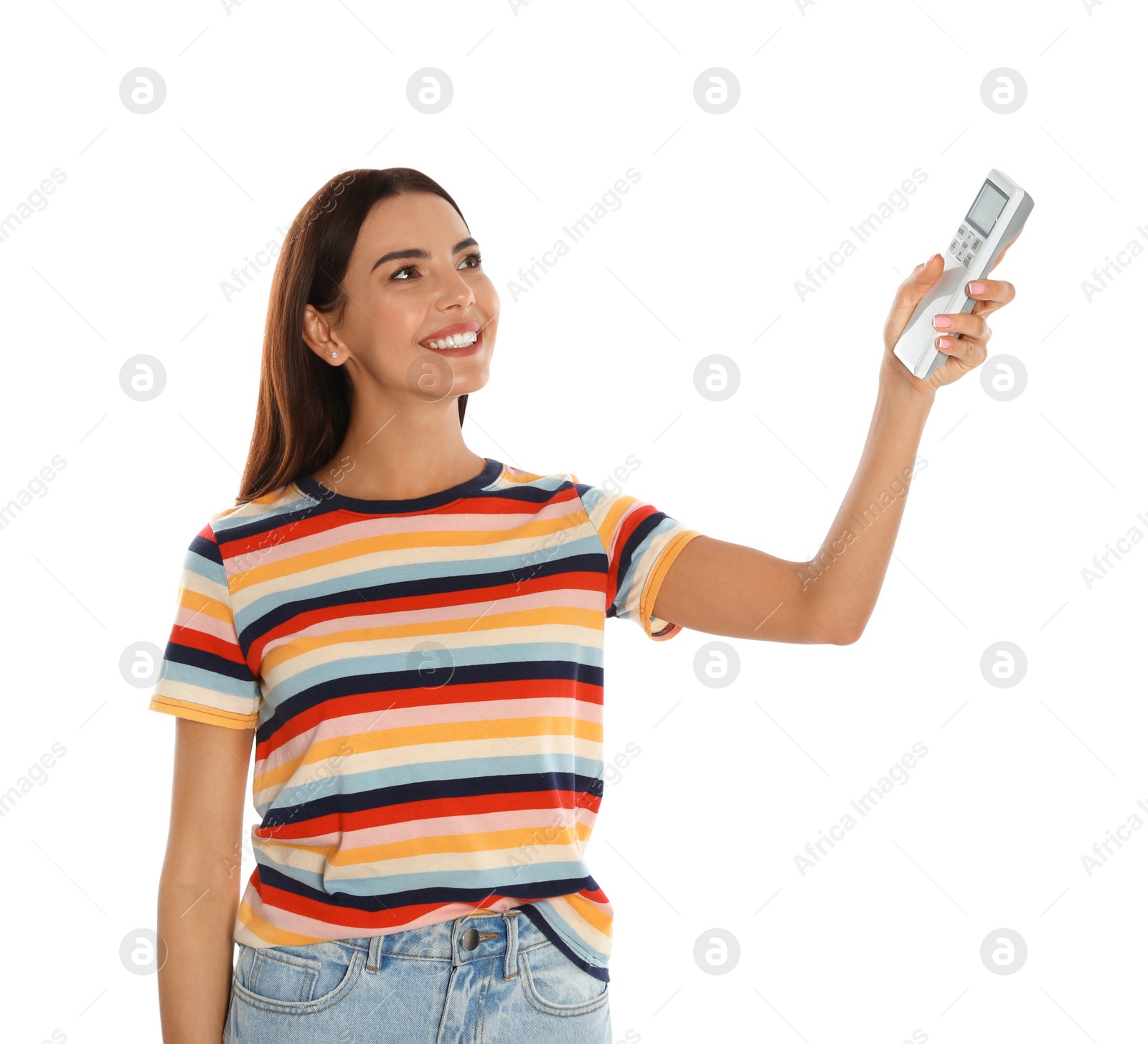 Photo of Young woman turning on air conditioner against white background