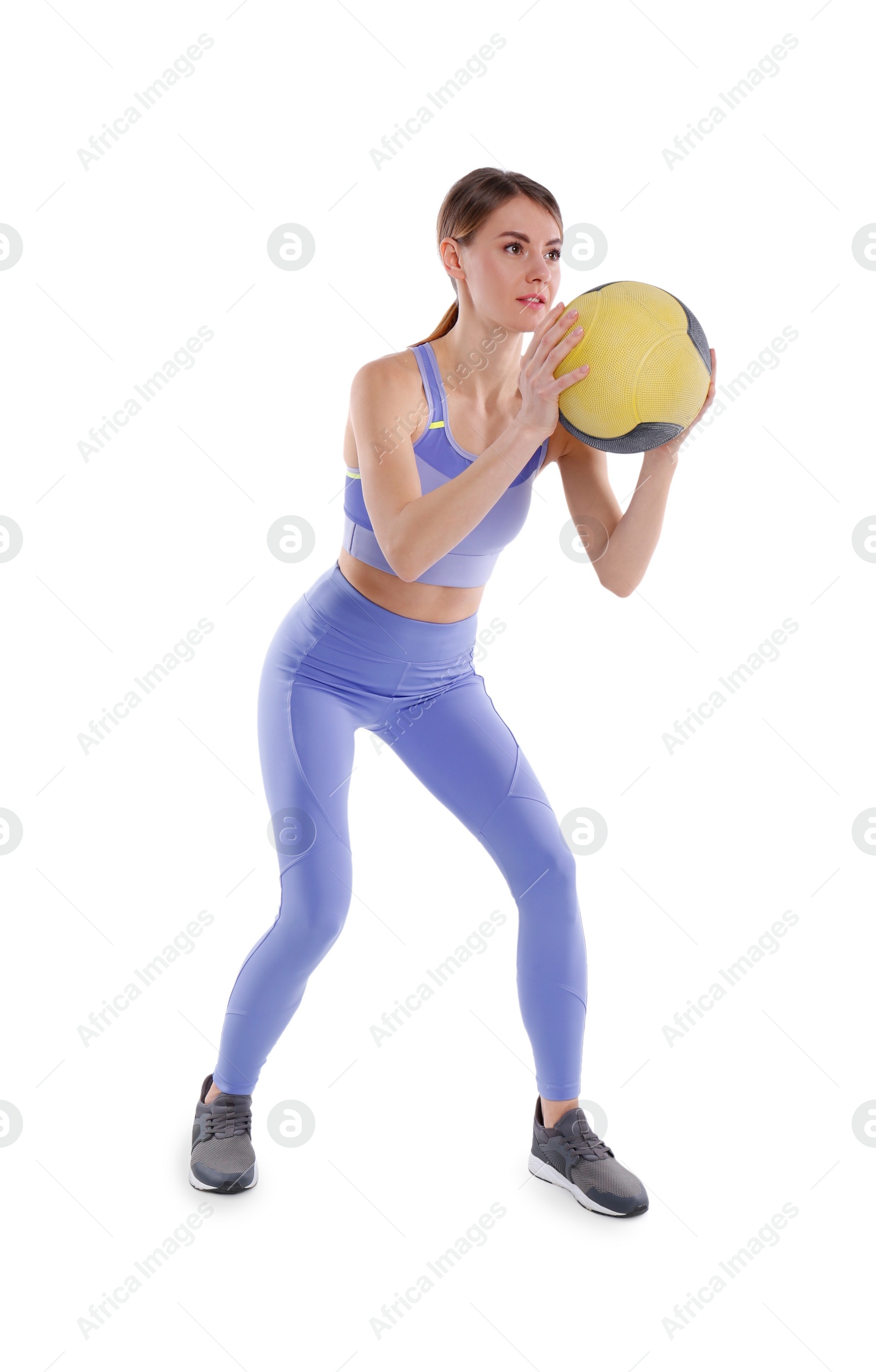 Photo of Athletic woman doing exercise with medicine ball isolated on white