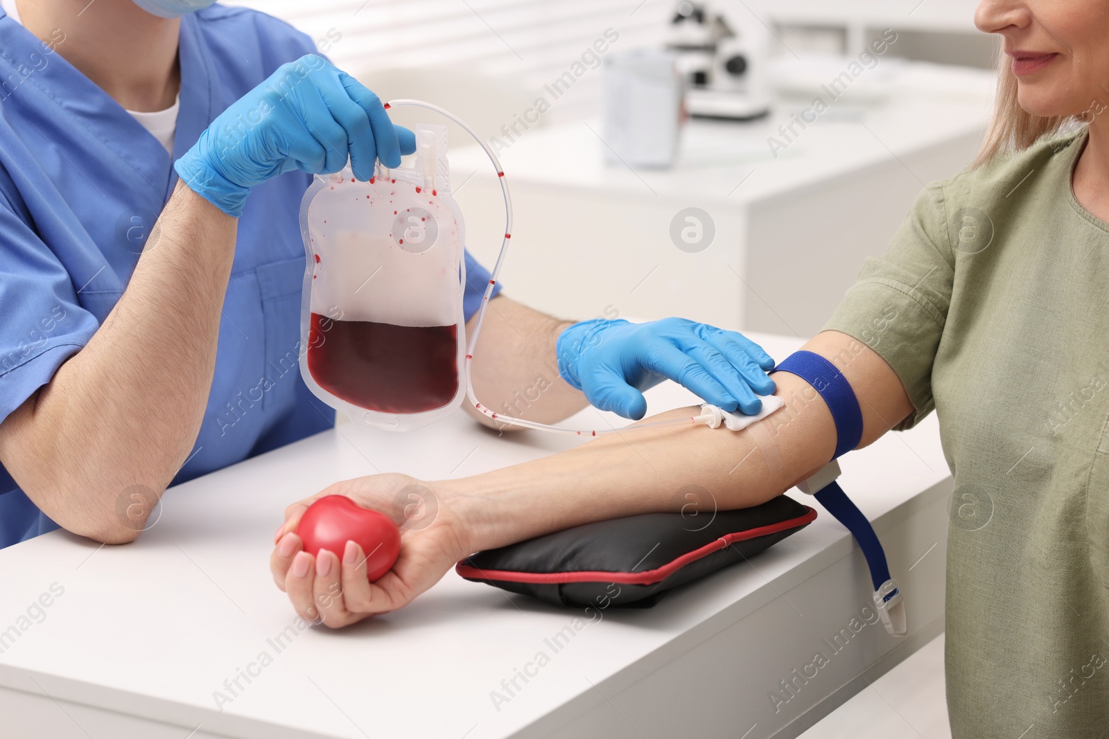 Photo of Patient undergoing blood transfusion in hospital, closeup