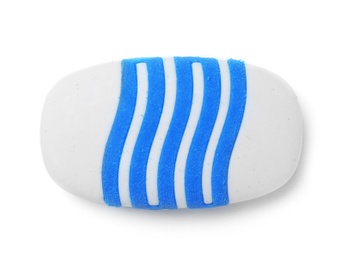 Photo of Striped eraser on white background. School stationery