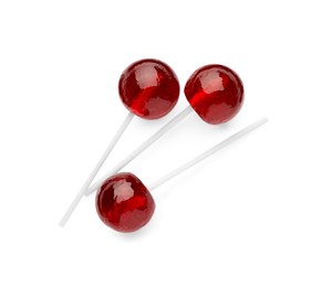Photo of Many sweet red lollipops isolated on white, top view