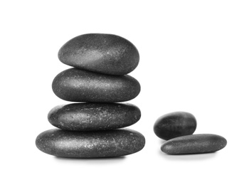 Stack of spa stones on white background