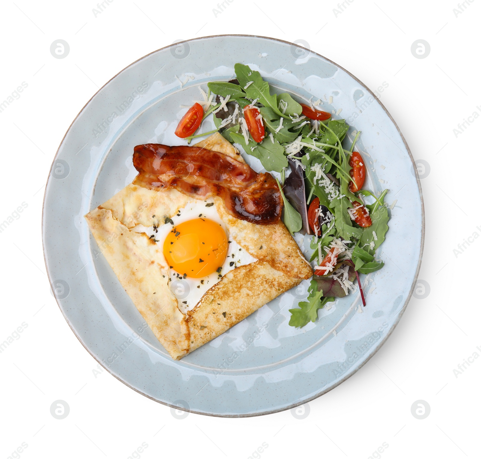 Photo of Delicious crepe with egg isolated on white, top view. Breton galette
