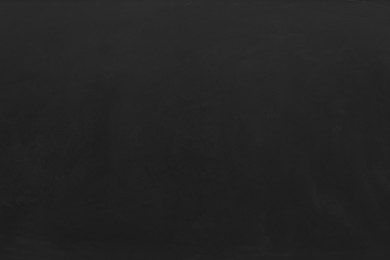 Photo of Blank black chalkboard as background. Space for text