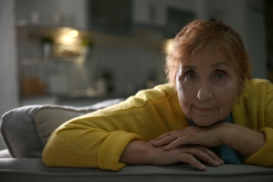 Photo of Portrait of elderly woman on sofa at home