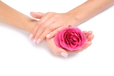 Photo of Woman holding rose on white background, closeup. Spa treatment