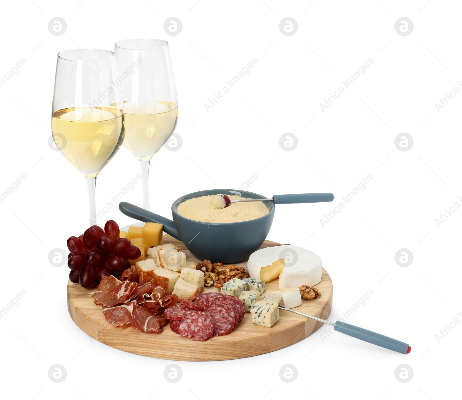 Photo of Fondue with tasty melted cheese, forks, different snacks and wine isolated on white