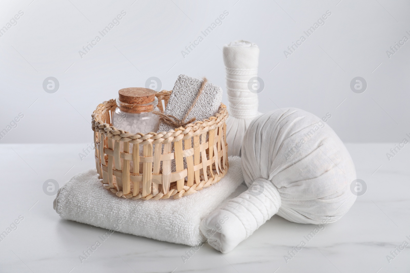 Photo of Spa composition with care products on white marble table