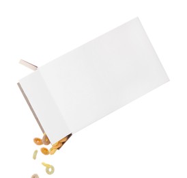 Photo of Pouring tasty cereal rings from paper box on white background