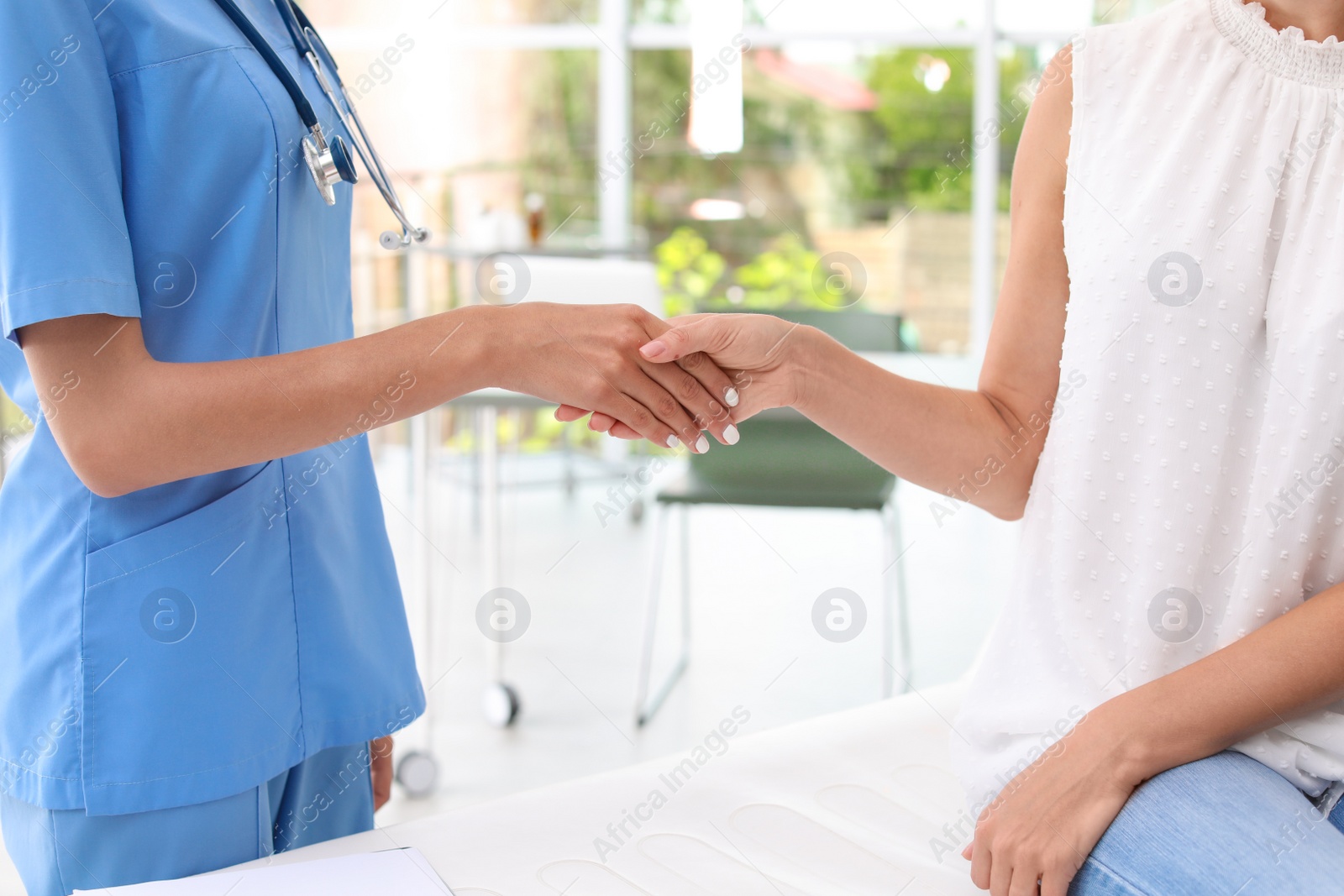 Photo of Patient having appointment with doctor in hospital