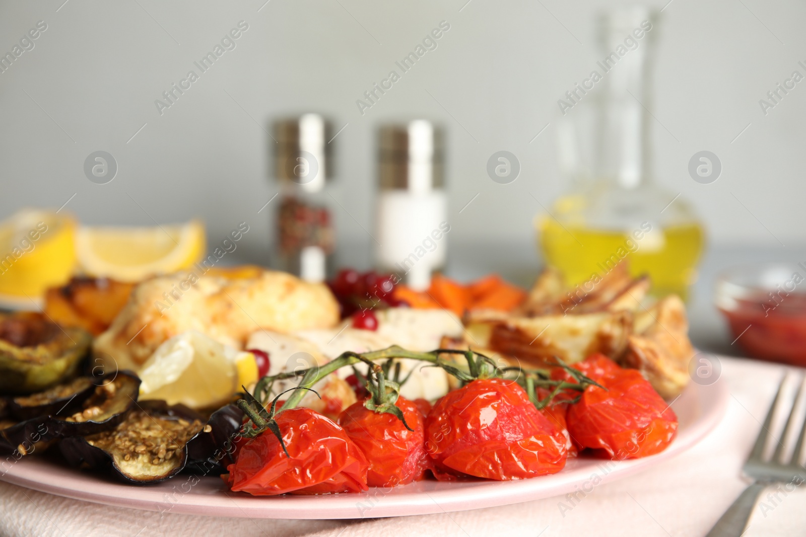 Photo of Tasty cooked chicken fillet and vegetables served on table, closeup. Healthy meals from air fryer