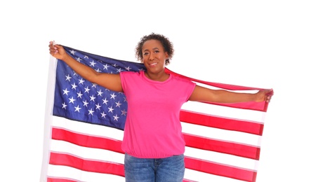 Photo of Portrait of happy African-American woman with USA flag on white background