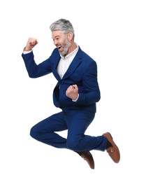 Photo of Mature businessman in stylish clothes jumping on white background