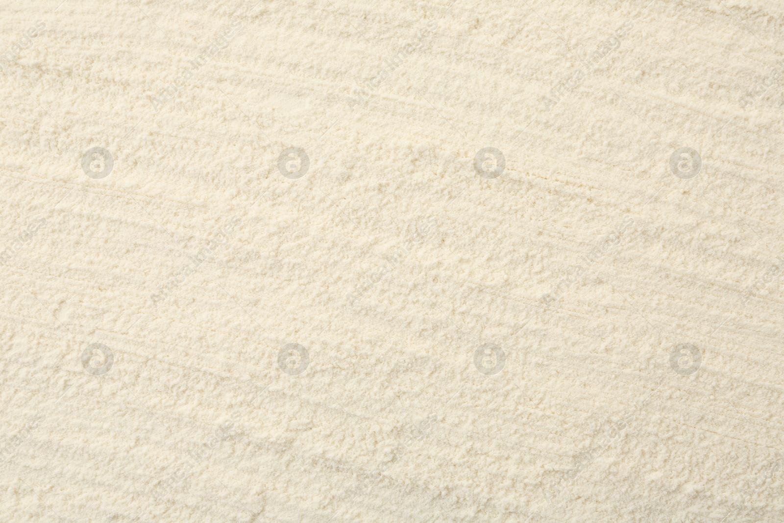 Photo of Texture of baking powder as background, top view