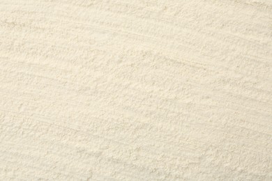 Photo of Texture of baking powder as background, top view