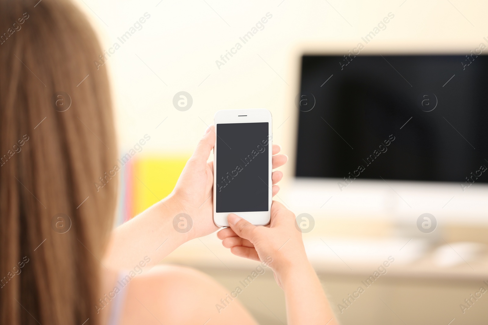 Photo of Woman using smartphone indoors, closeup. Mock up for design