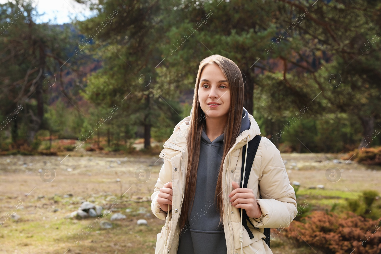 Photo of Woman with backpack in beautiful mountains. Space for text