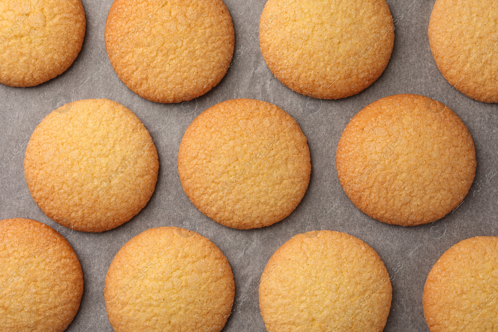 Photo of Delicious Danish butter cookies on baking tray, flat lay